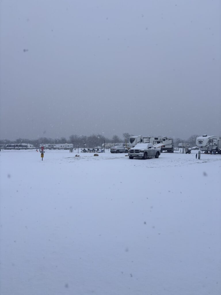 Snowy winter conditions at Lake Point RV Resort in Valley View TX with RVs and full hookups
